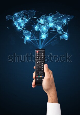 Hand with remote control, social media concept Stock photo © ra2studio