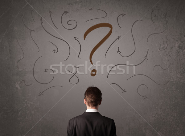 Hombre de negocios mirando signo de interrogación boceto pared negocios Foto stock © ra2studio