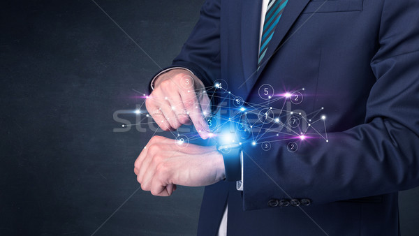 Smartwatch with networking concept. Stock photo © ra2studio