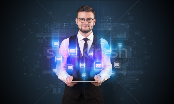 Mailing concept with businessman and tablet Stock photo © ra2studio