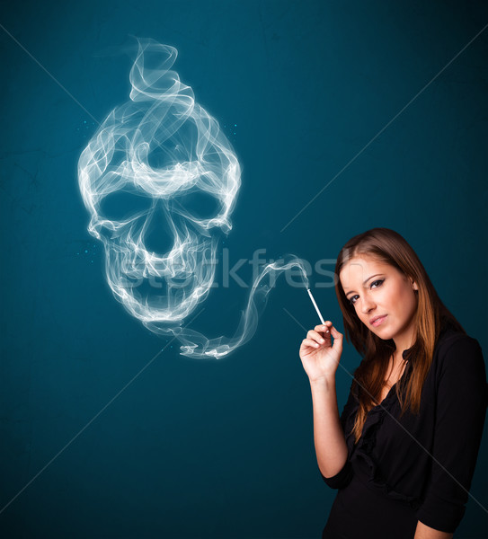 Fiatal nő dohányzás veszélyes cigaretta mérgező koponya Stock fotó © ra2studio