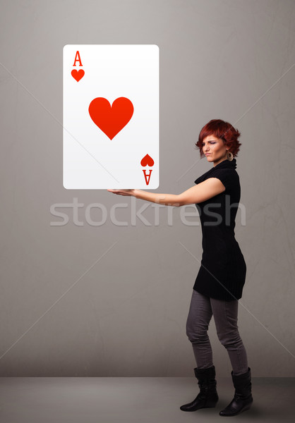 Nő tart piros szív ász fiatal nő Stock fotó © ra2studio