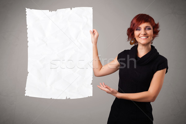Young girl holding crumpled white paper copy space Stock photo © ra2studio