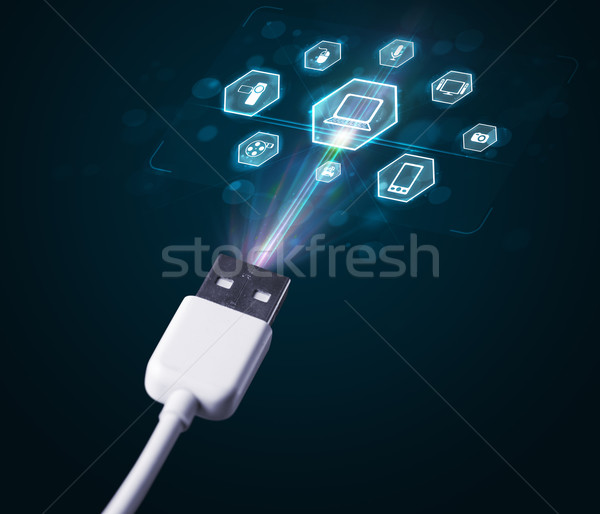 Electric cable with multimedia icons Stock photo © ra2studio