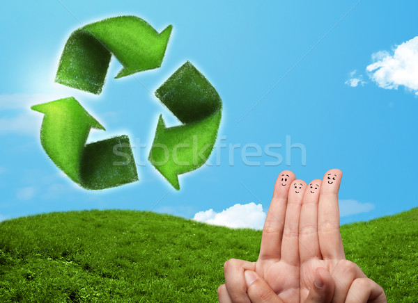 Happy smiley fingers looking at green leaf recycle sign Stock photo © ra2studio