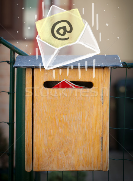 Envelope with email sign dropping into mailbox Stock photo © ra2studio