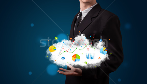 Young businessman presenting cloud with charts and graph icons a Stock photo © ra2studio