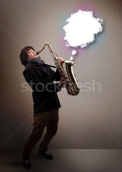 Zdjęcia stock: Młody · człowiek · gry · saksofon · kopia · przestrzeń · biały · Chmura
