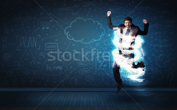 Happy business man jumping with storm cloud around him  Stock photo © ra2studio