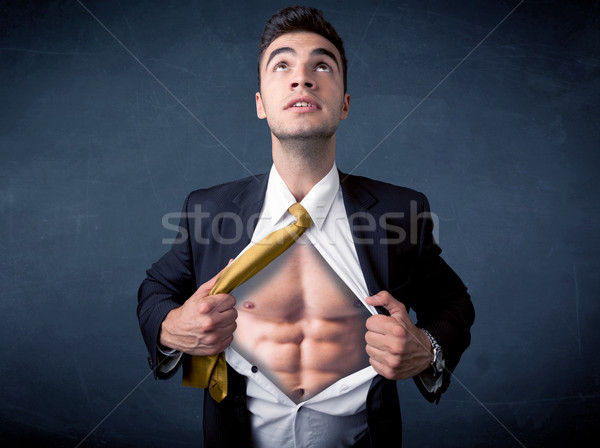 Businessman tearing off shirt and showing mucular body Stock photo © ra2studio