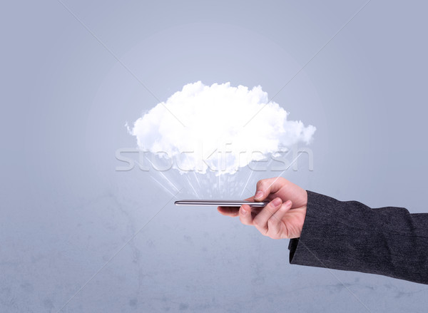 Hand holding phone with empty cloud Stock photo © ra2studio