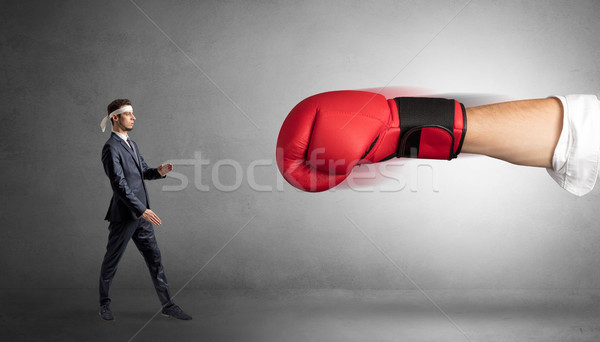 Little man fighting with big red boxing glove Stock photo © ra2studio