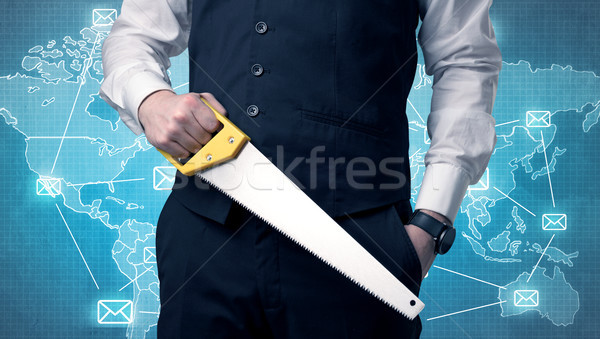 Handsome businassman standing with tool on his hand Stock photo © ra2studio