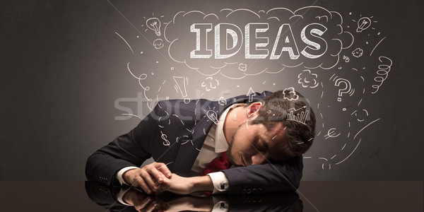 Businessman fell asleep at his workplace with ideas, sleep and tired concept Stock photo © ra2studio
