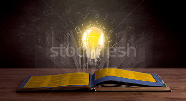Letters and lightbulb over book  Stock photo © ra2studio