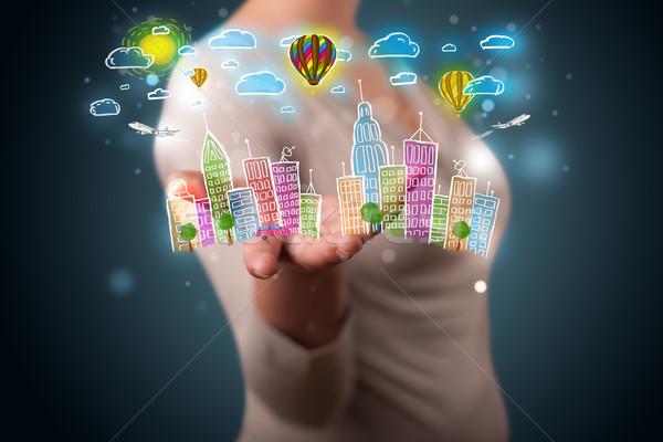 Young woman presenting colorful hand drawn metropolitan city Stock photo © ra2studio