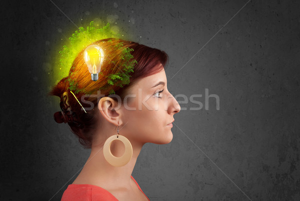 Stock photo: Young mind thinking of green eco energy with lightbulb