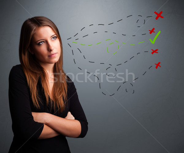 Young woman choosing between right and wrong signs Stock photo © ra2studio