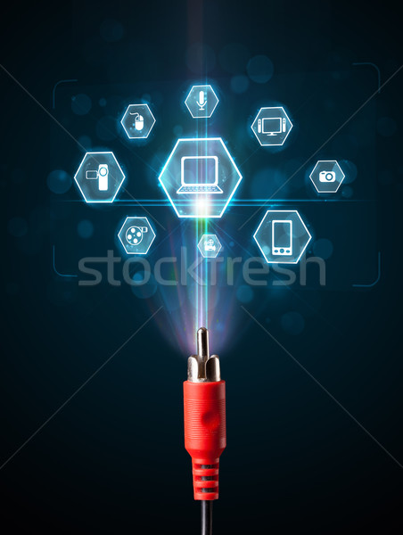 Electric cable with multimedia icons Stock photo © ra2studio