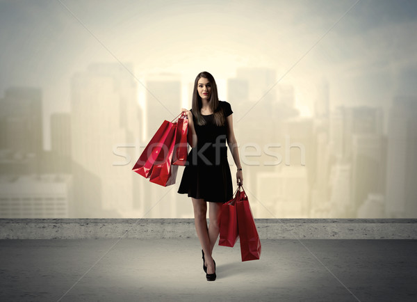 City woman standing with shopping bags Stock photo © ra2studio