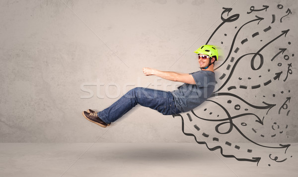 Funny man driving a flying vehicle with hand drawn lines after h Stock photo © ra2studio