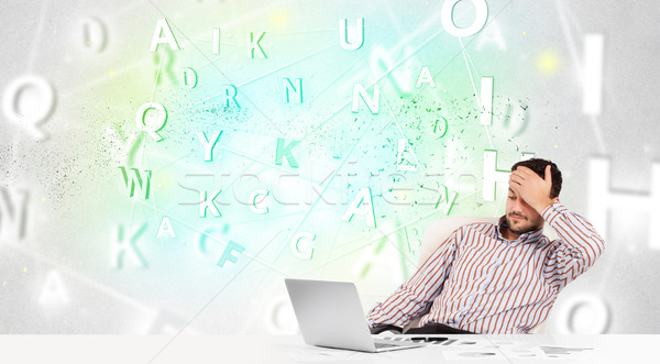 Business man at desk with green word cloud Stock photo © ra2studio