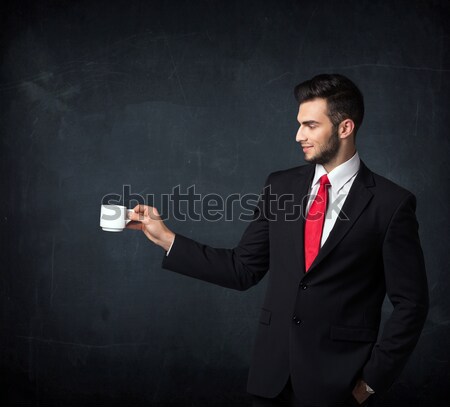 Businessman holding a white cup Stock photo © ra2studio