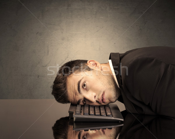 Frustrated businessman's head on keyboard Stock photo © ra2studio