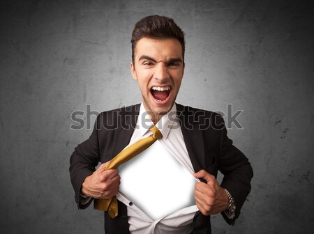 Businessman tearing off his shirt with white copyspace on chest Stock photo © ra2studio