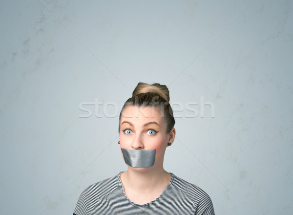 Stock photo: Young woman with glued mouth