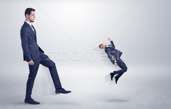 Small man fired by boss with white wallpaper Stock photo © ra2studio