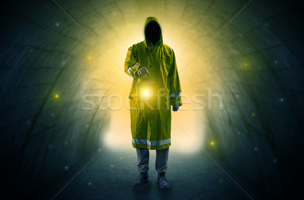 Man walking with lantern in a dark tunnel Stock photo © ra2studio