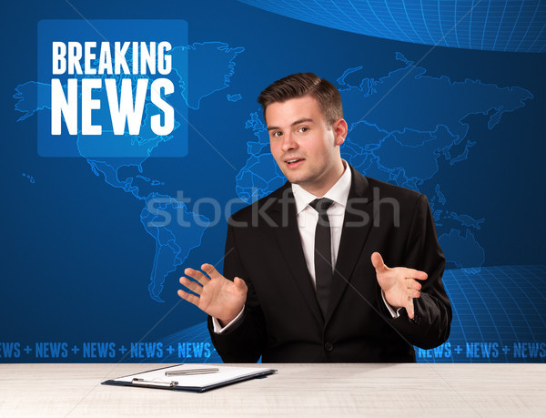 Television presenter in front telling breaking news with blue modern background Stock photo © ra2studio