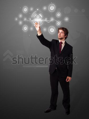 Stock photo: Businessman pressing modern business type of buttons