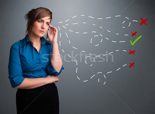 Young woman choosing between right and wrong signs Stock photo © ra2studio