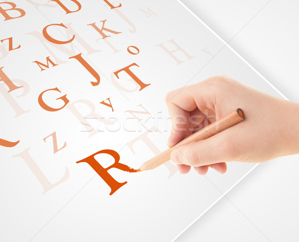 Hand writing various letters on white plain paper Stock photo © ra2studio