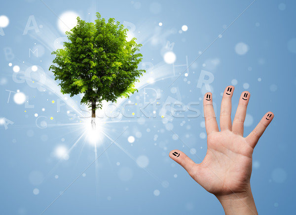 Happy finger smileys with green magical glowing tree Stock photo © ra2studio