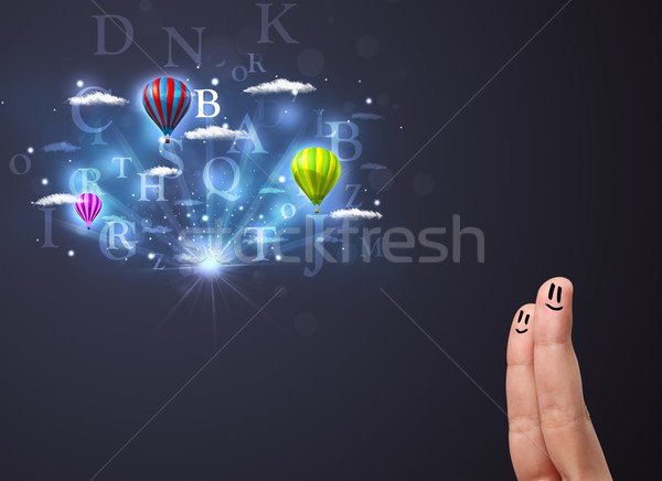 Happy cheerful smiley fingers looking at hot air balloons in the cloudy sky Stock photo © ra2studio