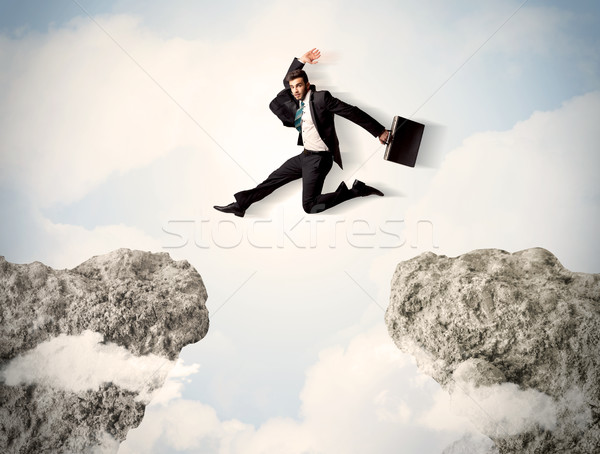 Feliz hombre de negocios saltar acantilado negocios hombre Foto stock © ra2studio