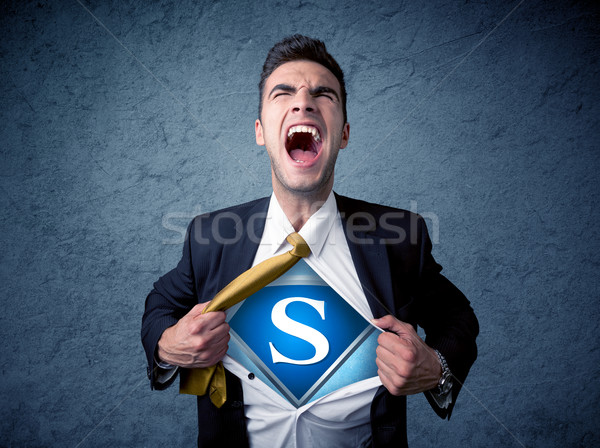 Businessman ripping off his shirt with superhero sign  Stock photo © ra2studio