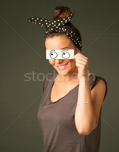 Young silly girl looking with hand drawn eye balls on paper Stock photo © ra2studio