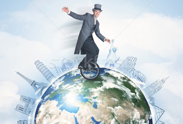 Man riding unicycle around the globe with major cities Stock photo © ra2studio