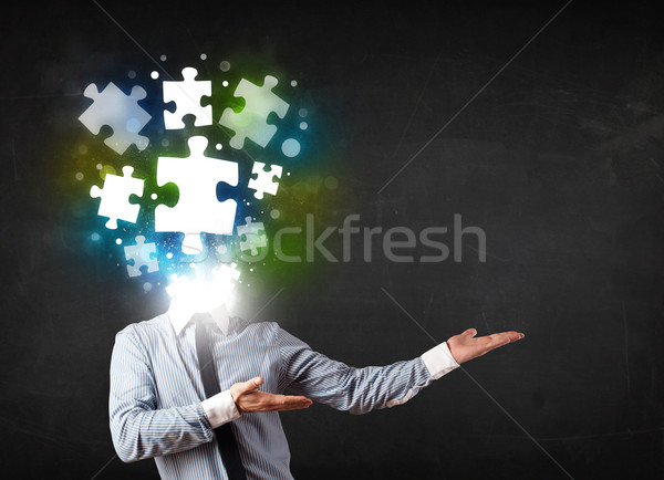 Character in suit with puzzle head concept Stock photo © ra2studio