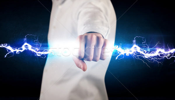 Homme d'affaires électricité lumière mains [[stock_photo]] © ra2studio