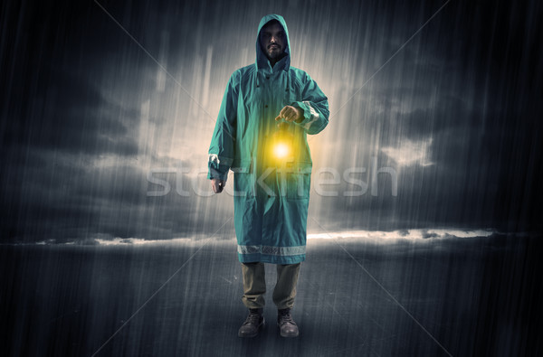 Man walking in storm with lantern Stock photo © ra2studio