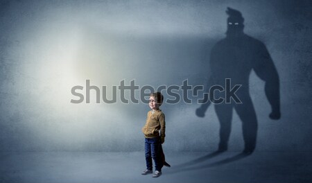 Peril man in front of a crumbly wall Stock photo © ra2studio