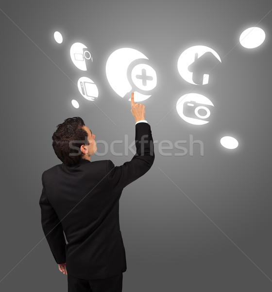 business man pressing touchscreen button  Stock photo © ra2studio