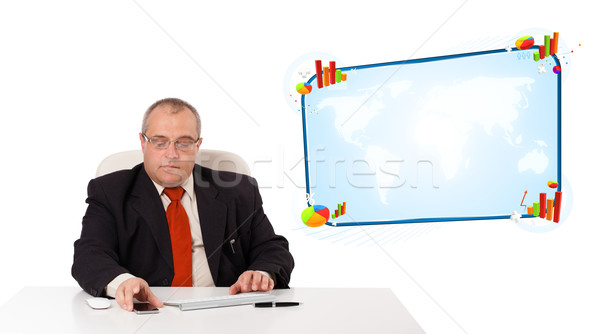 businessman sitting at desk and holding a mobilephone, isolated on white Stock photo © ra2studio