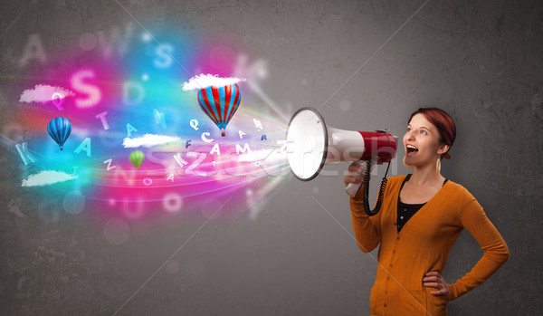 Cute girl shouting into megaphone and abstract text and balloons come out Stock photo © ra2studio