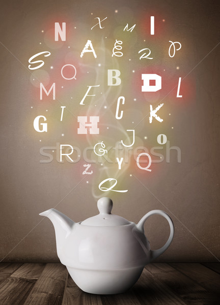 Tea pot with colorful letters Stock photo © ra2studio
